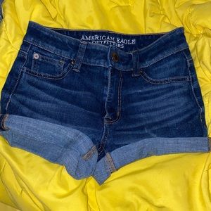 Dark wash American Eagle denim shorts.